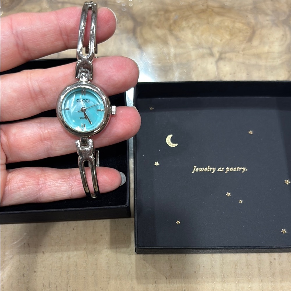 Gucci Silver and Blue Watch with Striking Face